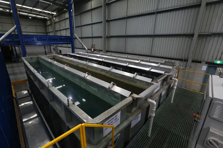 Industrial metal treatment tanks in factory